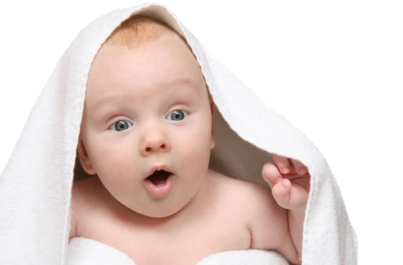 Adorable Baby Wrapped in White Towel with Surprised Expression and Wide Eyes