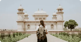 Serene Traveler Contemplating Elegant White Marble Mughal-Inspired Clipart Architecture