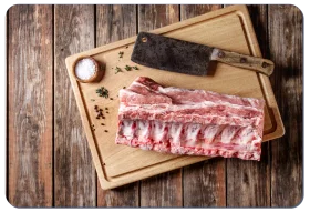 Raw Pork Ribs Clipart on Rustic Wooden Cutting Board with Butcher Knife